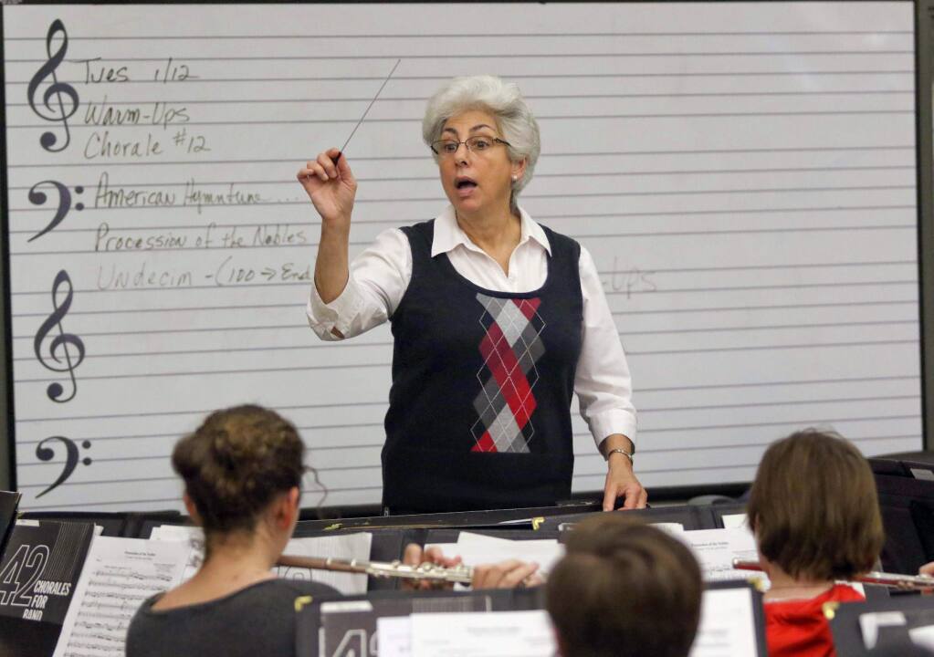 National award winning Casa Grande Band Director Arlene Burney working with the concert band Tuesday morning, January 12, 2016. (SCOTT MANCHESTER/ARGUS-COURIER STAFF)