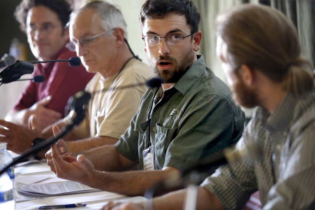 Kason Grady, from the North Coast Regional Water Quality Control Board, speaks during a panel discussion at a Sonoma County Growers Alliance fundraiser at the Sebastopol Grange on Sunday, June 14, 2015. (BETH SCHLANKER / The Press Democrat)