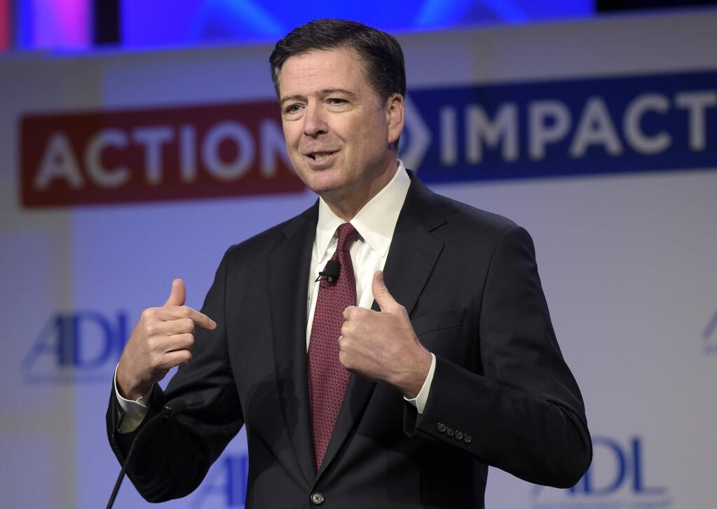 FILE - In this May 8, 2017, file photo, then-FBI Director James Comey speaks to the Anti-Defamation League National Leadership Summit in Washington. (AP Photo/Susan Walsh, File)