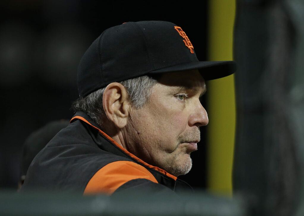 San Francisco Giants manager Bruce Bochy stands in the dugout during the ninth inning of the team's game against the San Diego Padres on Thursday, July 20, 2017, in San Francisco. San Diego won 5-2. (AP Photo/Eric Risberg)