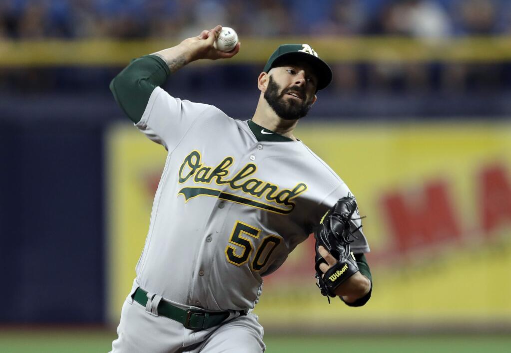 The Oakland Athletics' Mike Fiers pitches to the Tampa Bay Rays during the first inning Tuesday, June 11, 2019, in St. Petersburg, Fla. (AP Photo/Chris O'Meara)