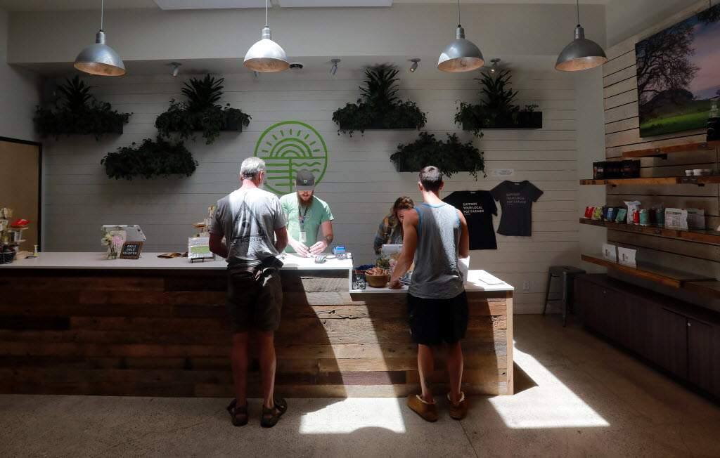 Customers weigh their options at the Solful Cannabis Dispensary in Sebastopol, a town which supports two dispensaries. (John Burgess/Press Democrat)