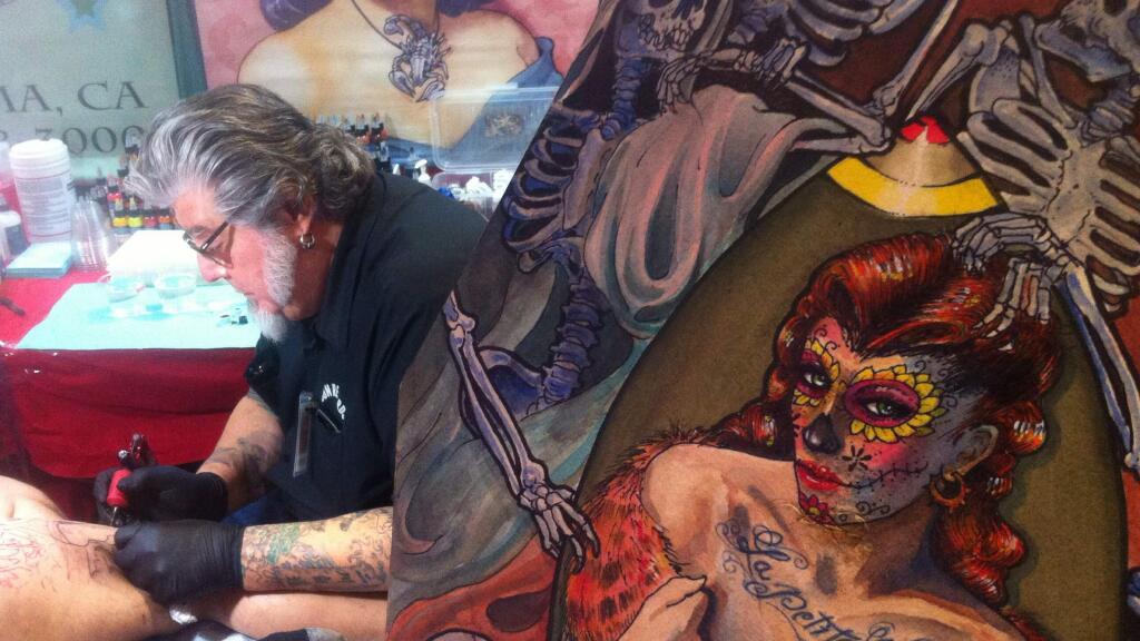 Sonoma tattoo artist Shotsie Gorman gets down to it at the Santa Rosa Tattoos and Blues Festival held at the Flamingo Resort in Santa Rosa, Friday Feb 26, 2016. (Kent Porter / Press Democrat)
