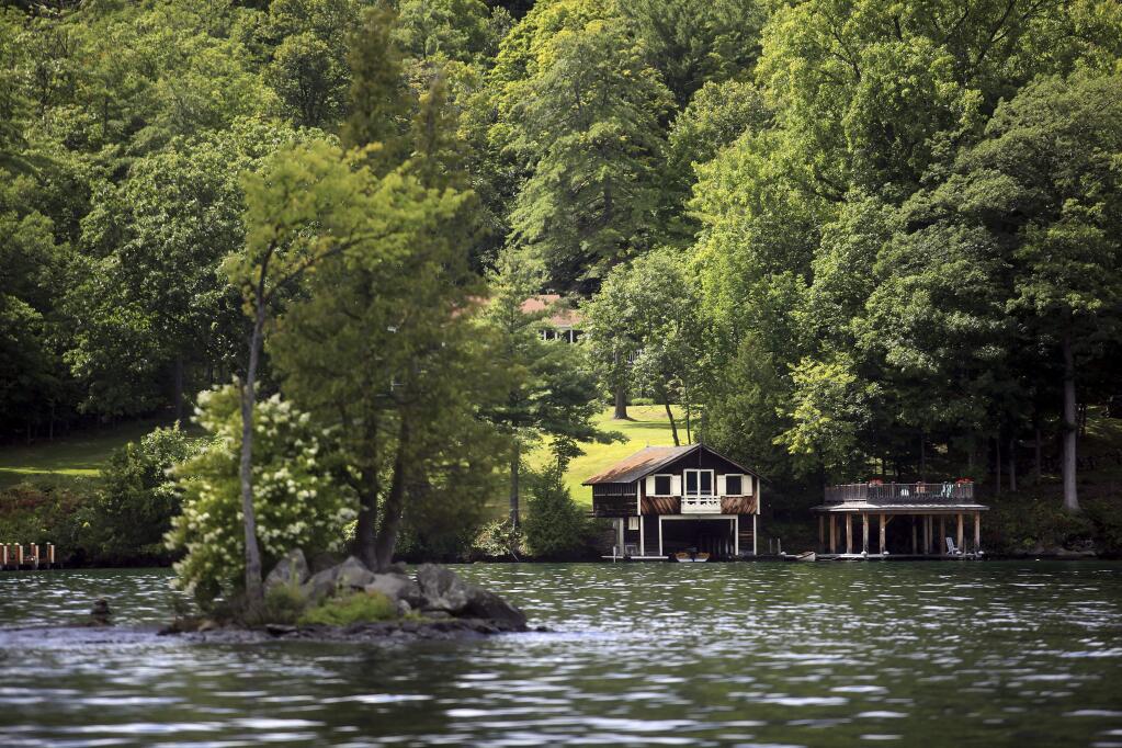 Boat houses along Lake George in New York's Adirondack Mountains, one of the first destinations for summer vacations in the 19th century. (NATHANIEL BROOKS / New York Times)