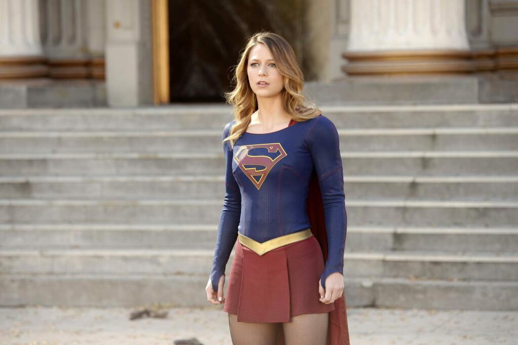 In this image released by CBS, Melissa Benoist appears in a scene from 'Supergirl.' The CW said Thursday, May 12, 2016, that it's picking up the series from CBS, where it debuted last year. (Darren Michaels/Warner Bros. Entertainment Inc. via AP)