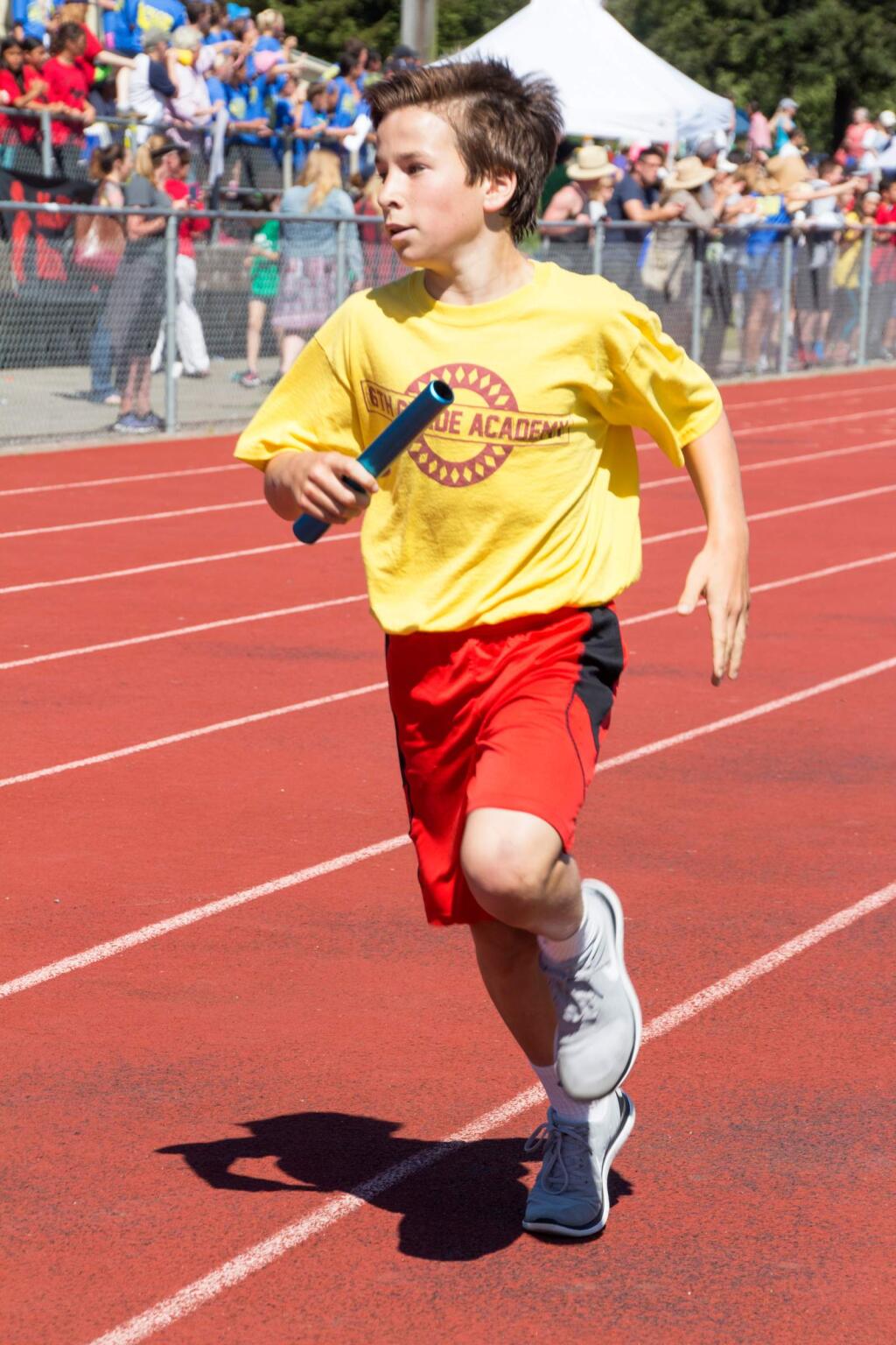 Many schools, including Penngrove Elementary, compete against each other in various track and field activities, such as 400 and 800 meter relays, during the large school West Side Relays at Petaluma High School on Tuesday, May 17, 2016. (ASHLEY COLLINGWOOD/FOR THE ARGUS-COURIER)