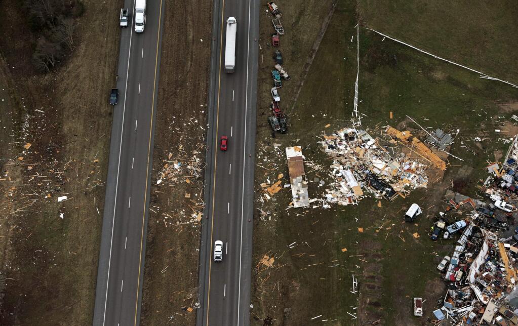 Cars are scattered near a junkyard off Interstate 55 in Perryville, Mo., on Wednesday, March 1, 2017, the morning after a tornado struck the area. (Robert Cohen/St. Louis Post-Dispatch via AP)