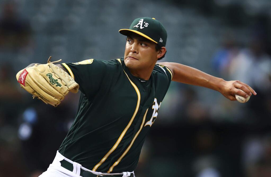 Oakland Athletics pitcher Sean Manaea works against the Seattle Mariners in the first inning Monday, Aug. 13, 2018, in Oakland. (AP Photo/Ben Margot)
