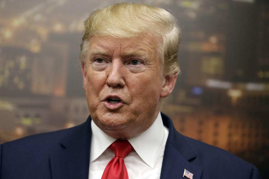 President Donald Trump speaks to the media as he visits the El Paso Regional Communications Center after meeting with people affected by the El Paso mass shooting, Wednesday, Aug. 7, 2019, in El Paso, Texas. (AP Photo/Evan Vucci)