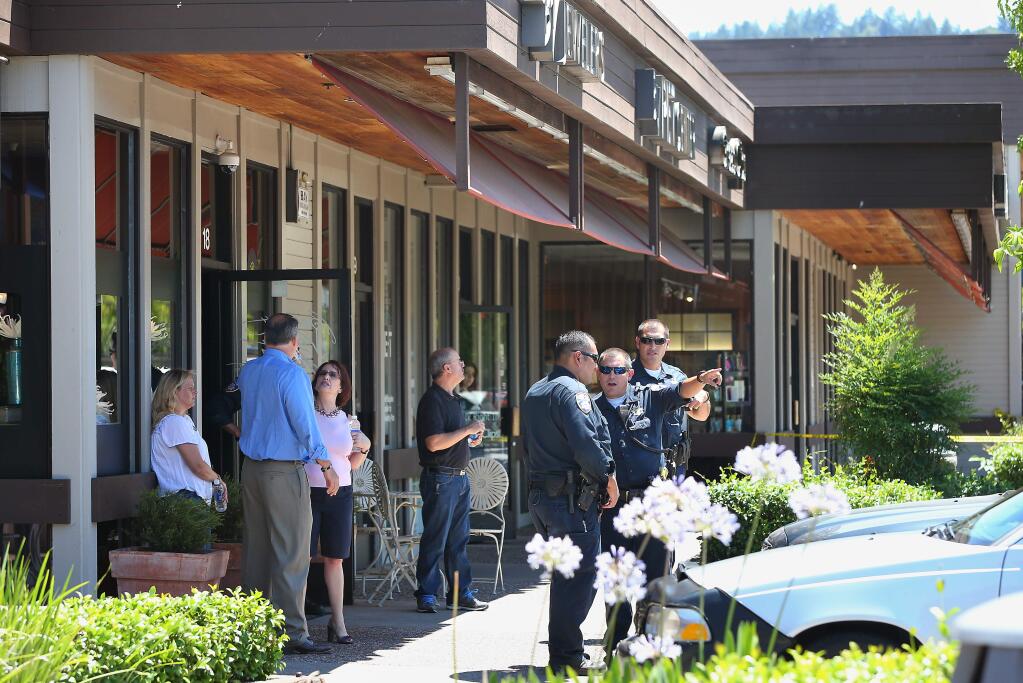 Santa Rosa police investigate the scene of a robbery at Bennett Valley Jewelers in Santa Rosa on Thursday, July 10, 2014. (Christopher Chung/ The Press Democrat)
