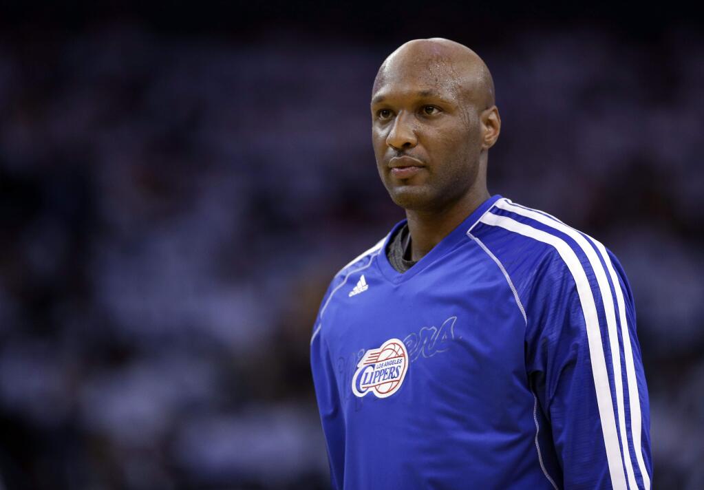FILE - This Jan. 2, 2013 file photo shows Los Angeles Clippers' Lamar Odom (7) in action against the Golden State Warriors during an NBA basketball game in Oakland, Calif. Authorities say former NBA and reality TV star Odom has been hospitalized after he was found unconscious at a Nevada brothel on Tuesday, Oct. 13, 2015. (AP Photo/Marcio Jose Sanchez, File)