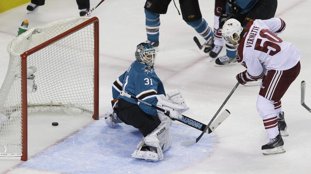 Arizona Coyotes center Antoine Vermette, right, scores a power play goal against San Jose Sharks goalie Antti Niemi, left, during the first period Saturday, Nov. 22, 2014, in San Jose. (AP Photo/Eric Risberg)