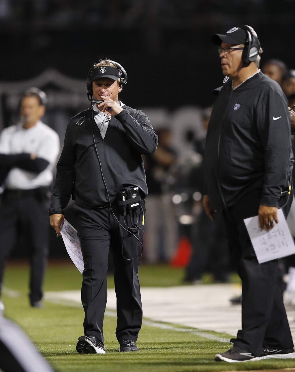 Oakland Raiders head coach Jon Gruden walks on the sideline during the first half of a preseason game between the Raiders and the Detroit Lions in Oakland, Friday, Aug. 10, 2018. (AP Photo/John Hefti)