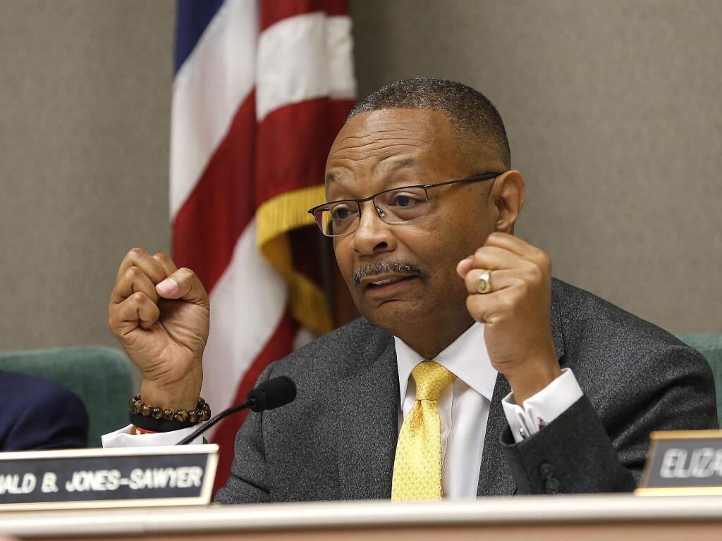 Assemblyman Reginald Jones-Sawyer, D-Los Angeles, chairman of the Assembly Public Safety Committee, discusses legislation to restrict the use of deadly force by police, during a hearing on the measure, Tuesday, April 9, 2019, in Sacramento, Calif. (AP Photo/Rich Pedroncelli)