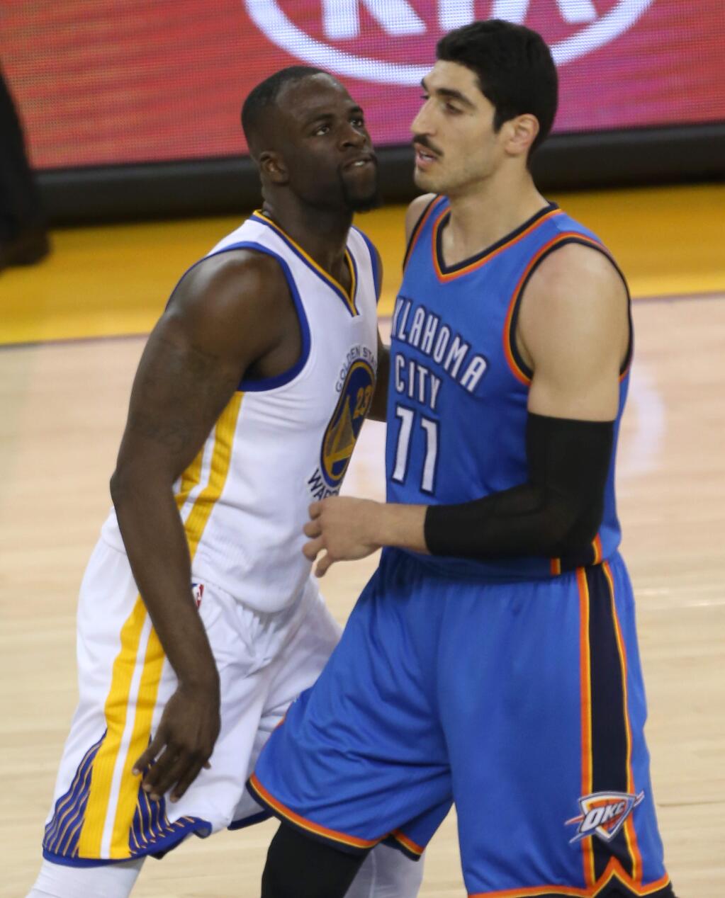 Golden State Warriors' Draymond Green stares down Oklahoma City Thunder's Enes Kanter after scoring, during their game in Oakland on Wednesday, May 18, 2016. The Warriors defeated the Thunder 118-91.(Christopher Chung/ The Press Democrat)