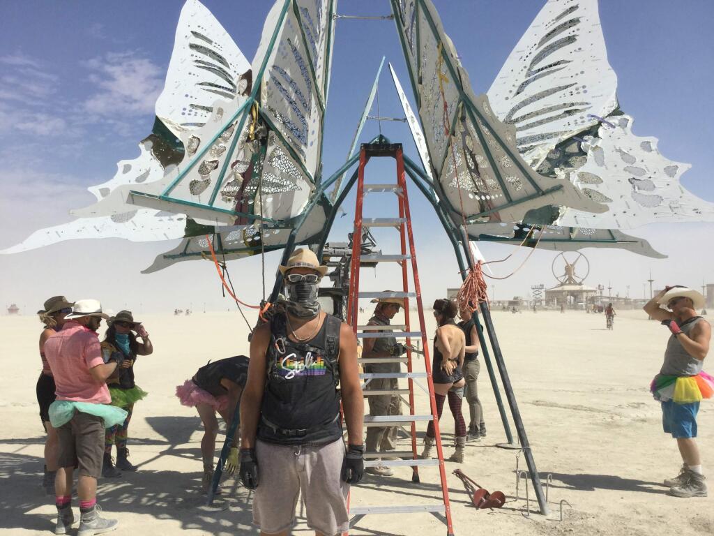 Scenes from Burning Man, Tuesday, Aug. 30, 2016. Dimitar Maznev of Santa Rosa, an immigrant from Bulgaria, helps out on the “Imago” crew. (Chris Smith / Press Democrat)