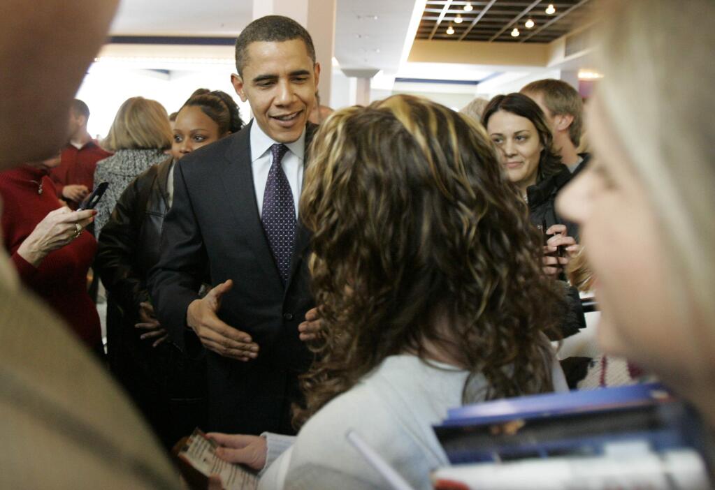 Barack Obama greets diners at a Des Moines, Iowa food court on caucus day in 2008. (SPENCER GREEN / Associated Press)