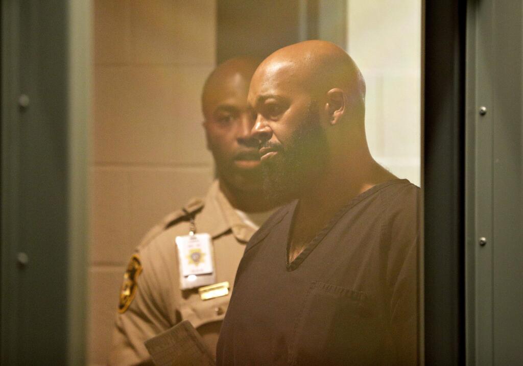 Rap music mogul Marion Suge Knight appears in court on a traffic warrant Thursday, Oct. 30, 2014, in Las Vegas following his arrest as a fugitive in a California robbery case. Thursday's court appearance for the 49-year-old founder of Death Row Records stems from a suspended license charge in Las Vegas. Knight and comedian Katt Williams were arrested and charged with robbery Wednesday after a celebrity photographer reported the men stole her camera on Sept. 5 in Beverly Hills, Calif. (AP Photo/John Locher)