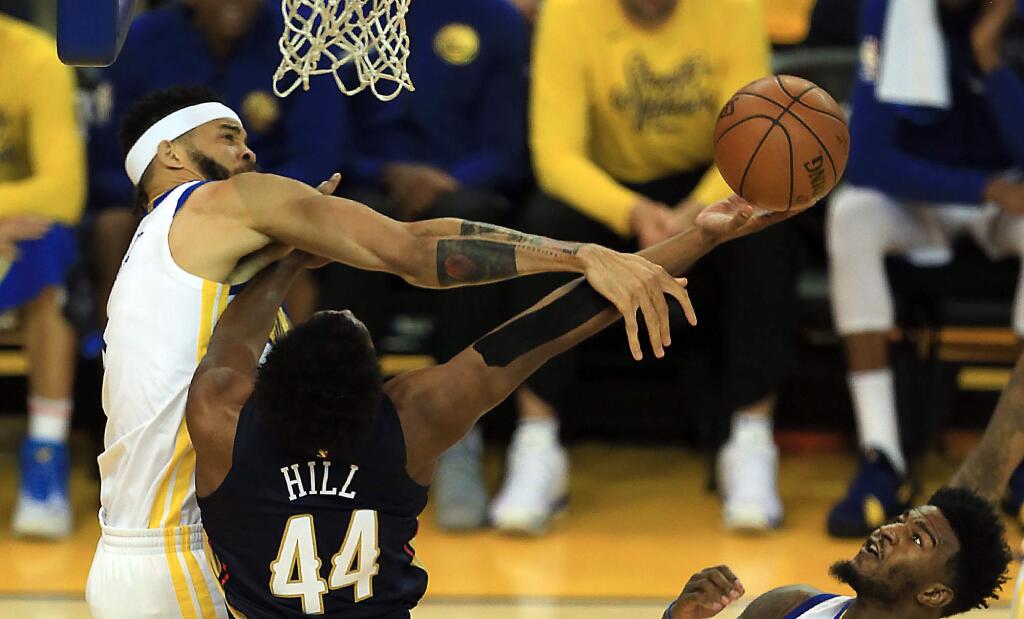 JaVale McGee of the Warriors swats the shot of Solomon Hill of the Pelicans during Game 1 of Golden State's 123-101 victory in the NBA Western Conference semifinals in Oakland, Saturday April 28, 2018. (Kent Porter / The Press Democrat)