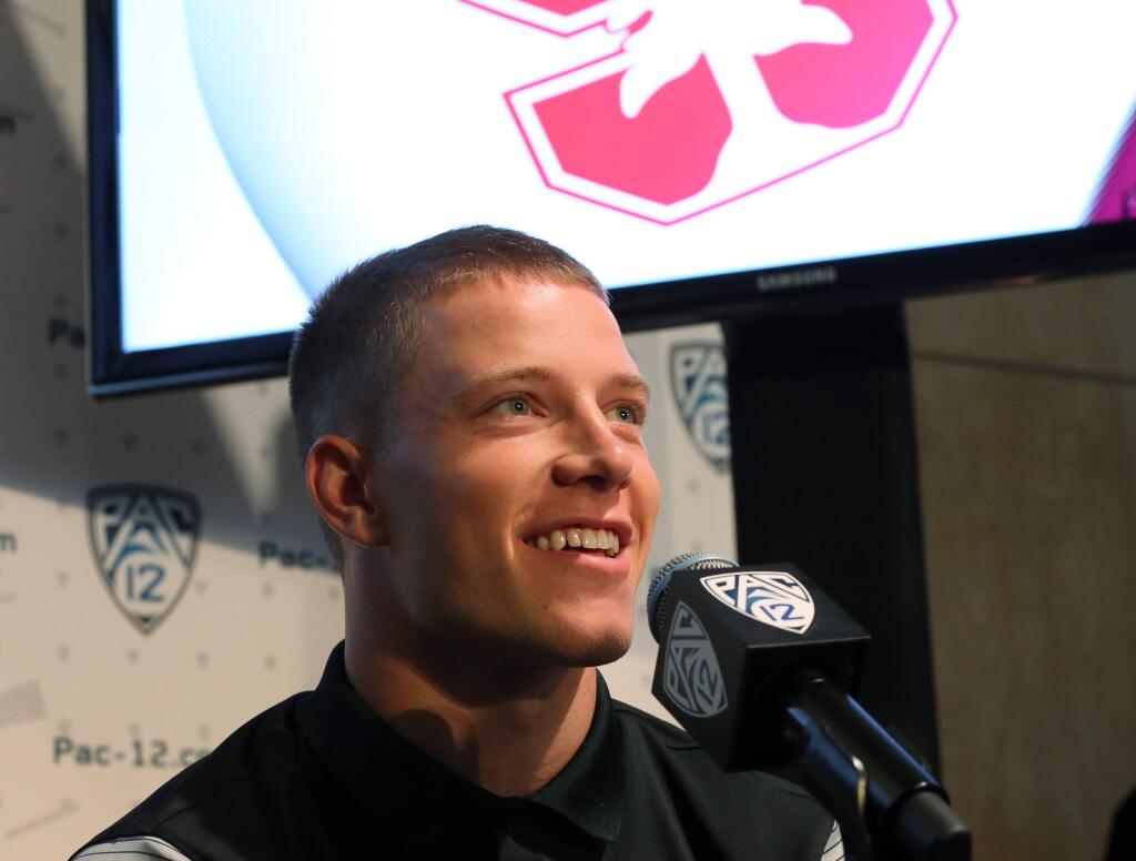 Stanford running back Christian McCaffrey speaks at the Pac-12 college football media day in Los Angeles Friday, July 15, 2016. (AP Photo/Reed Saxon)