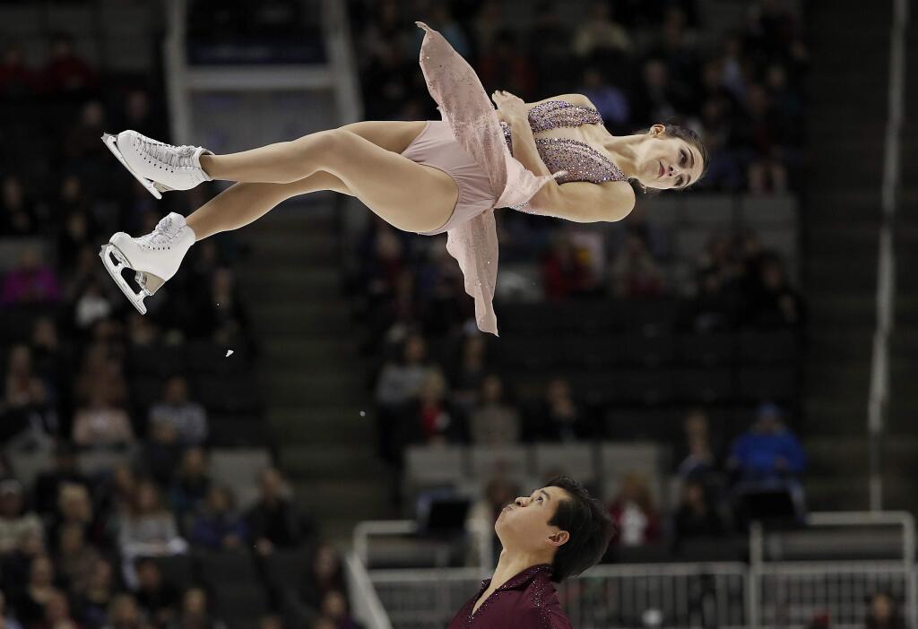 FILE - In this Jan. 6, 2018, file photo, Marissa Castelli, top, and Mervin Tran perform during the pairs free skate event at the U.S. Figure Skating Championships, in San Jose, Calif. San Francisco police have recovered two pricey costumes and a pair of ice skates belonging to U.S. Olympic figure skater Marissa Castelli.The items were stolen in a car break-in last week while Castelli and her parents visited San Francisco. The San Francisco Chronicle reports police told Castelli Wednesday, Jan. 17, 2018, they found her skates and custom skating competition dresses, each worth over $1,000.(AP Photo/Tony Avelar, File)