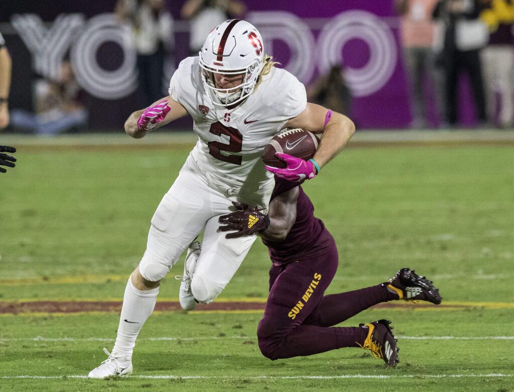In this Thursday, Oct. 18, 2018, file photo, Stanford's Trenton Irwin slips the tackle of an Arizona State defender during the second half in Tempe, Ariz. Stanford faces Washington State on Saturday, Oct. 27. (AP Photo/Darryl Webb, File)