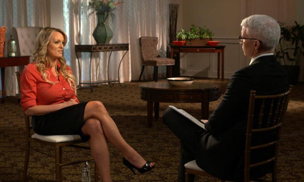 This image released by CBS News shows Stormy Daniels, left, during an interview with Anderson Cooper which will air on Sunday, March 25, 2018, on '60 Minutes.' (CBS News/60 Minutes via AP)