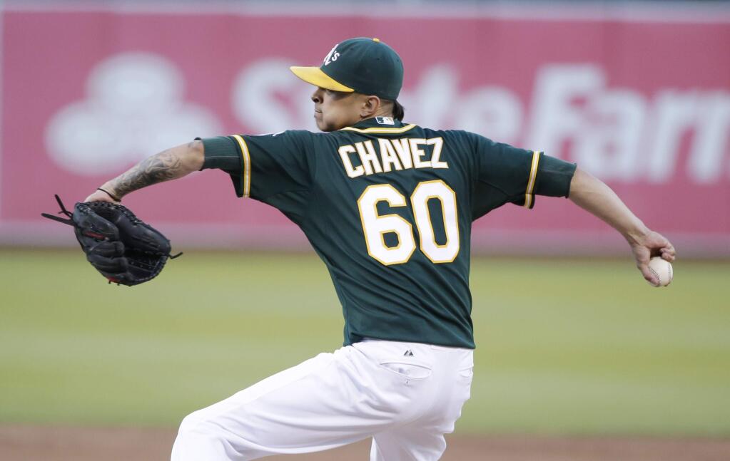 Oakland Athletics starting pitcher Jesse Chavez throws to the Houston Astros during the first inning of a baseball game on Wednesday, July 23, 2014, in Oakland, Calif. (AP Photo)
