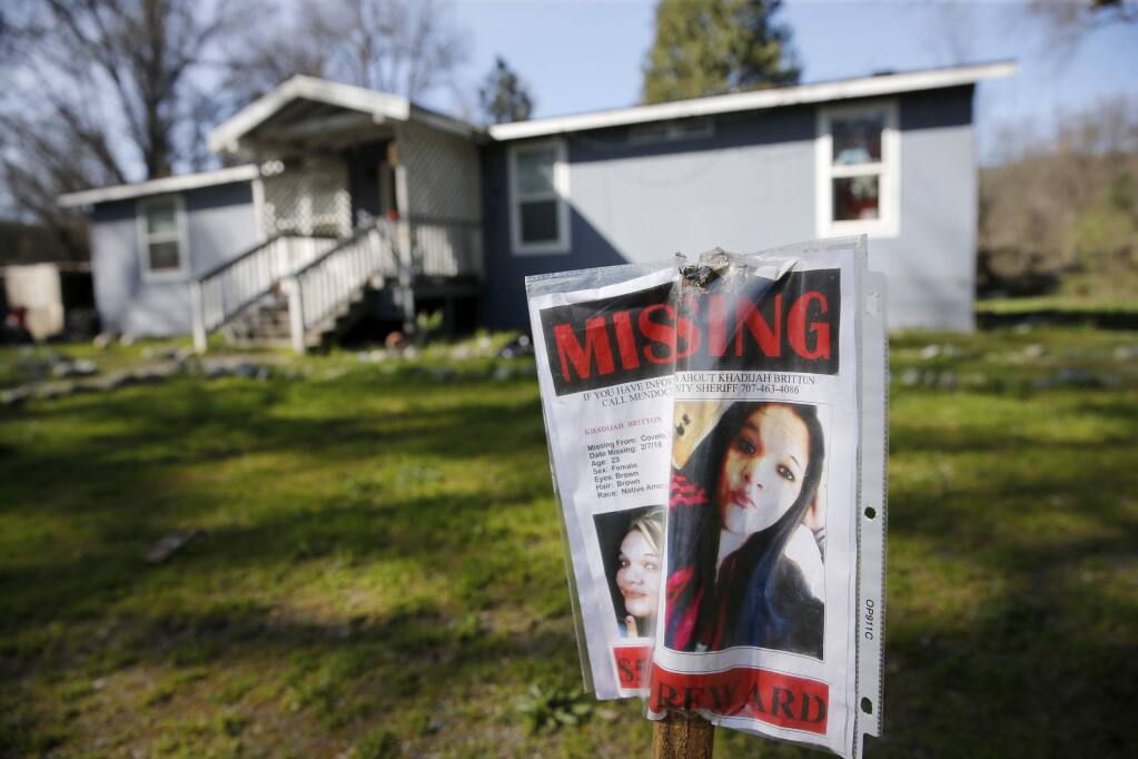 A missing sign for Khadijah Britton, 23, is displayed outside her family home on Tuesday, March 27, 2018, in Covelo, California. (BETH SCHLANKER / The Press Democrat)