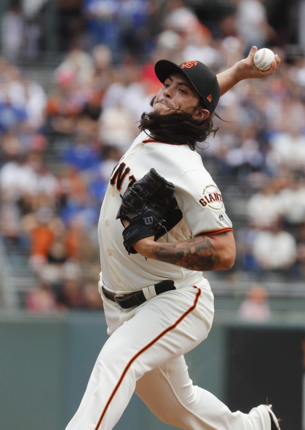 San Francisco Giants starting pitcher Dereck Rodriguez pitches against the Los Angeles Dodgers during the first inning in San Francisco, Saturday, Sept. 29, 2018. (AP Photo/Jim Gensheimer)