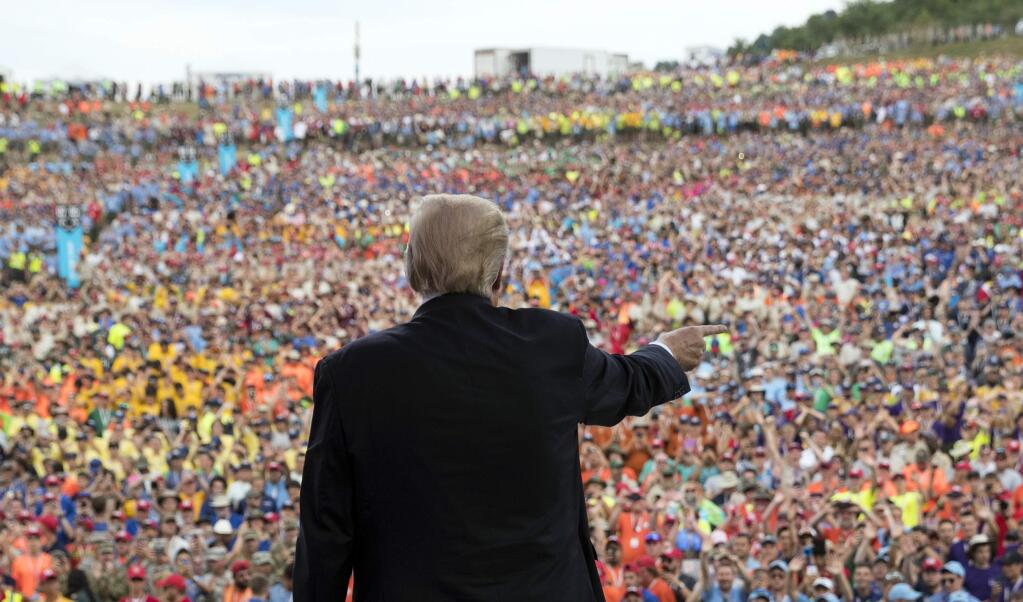 President Donald Trump gestures to the crowd after speaking at the 2017 National Scout Jamboree in Glen Jean, W.Va., Monday, July 24, 2017. (AP Photo/Carolyn Kaster)