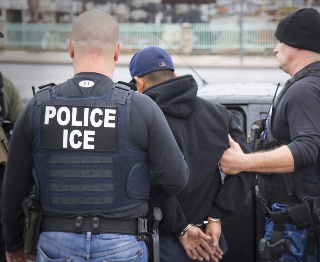 In this Tuesday, Feb. 7, 2017, photo released by U.S. Immigration and Customs Enforcement shows foreign nationals being arrested during a targeted enforcement operation conducted by U.S. Immigration and Customs Enforcement (ICE) aimed at immigration fugitives, re-entrants and at-large criminal aliens in Los Angeles. (Charles Reed/U.S. Immigration and Customs Enforcement via AP)