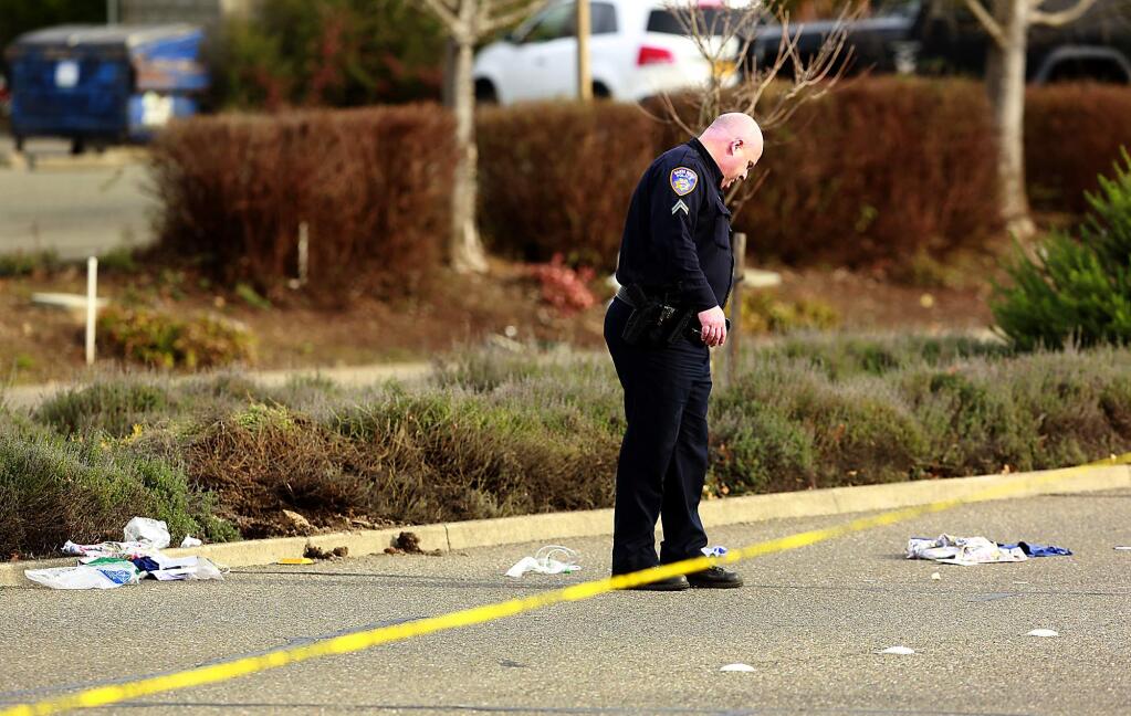 Santa Rosa police officers investigate the scene on Oakmont Drive where two pedestrians were struck by a 77-year-old woman who was arrested for suspected driving under the influence, Wednesday, Jan. 20, 2016. (JOHN BURGESS / The Press Democrat)