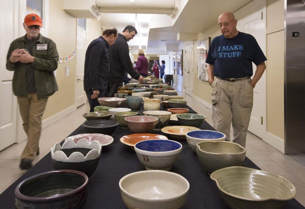 Attendees at the Saturday, Feb. 25, Chili Bowl Express at the Sonoma Community Center had their choice of over 700 handmade ceramic bowls - which was theirs to keep - and three kinds of chili. As well as food and entertainment, there was a ceramics exhibition in the upstairs gallery. Money raised at the fundraiser will be used for the center's ceramics program and a new kiln. (Photo by Robbi Pengelly/Index-Tribune)