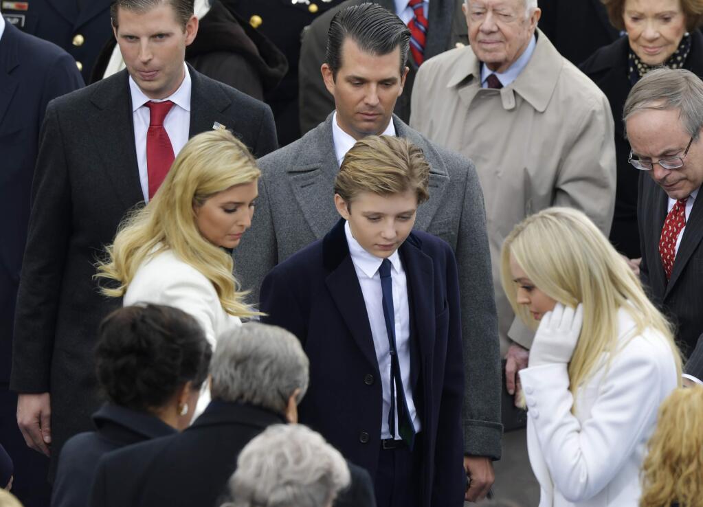 President-elect Donald Trump's children look for the seats before the 58th Presidential Inauguration at the U.S. Capitol for President-elect Donald Trump in Washington, Friday, Jan. 20, 2017. (AP Photo/Susan Walsh)