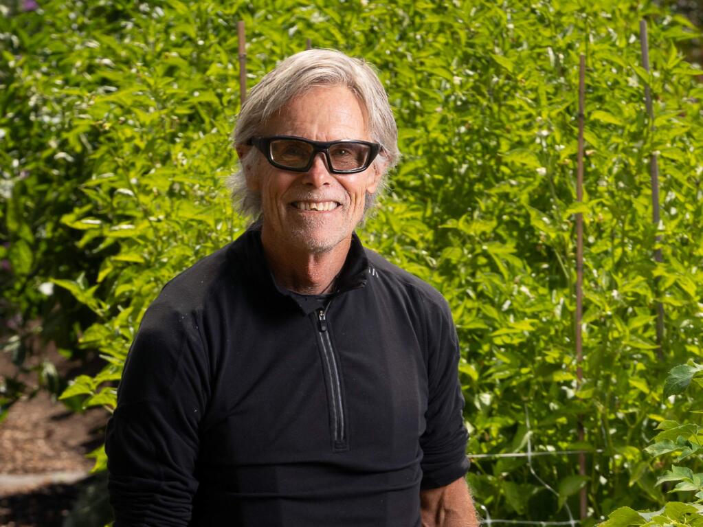 Mike Benziger on his farm next to his house and Benziger winery where he grows medicinal herbs like ashitaba and savory, as well as Padrone peppers and tomatoes. (Chris Hardy/Sonoma Magazine)