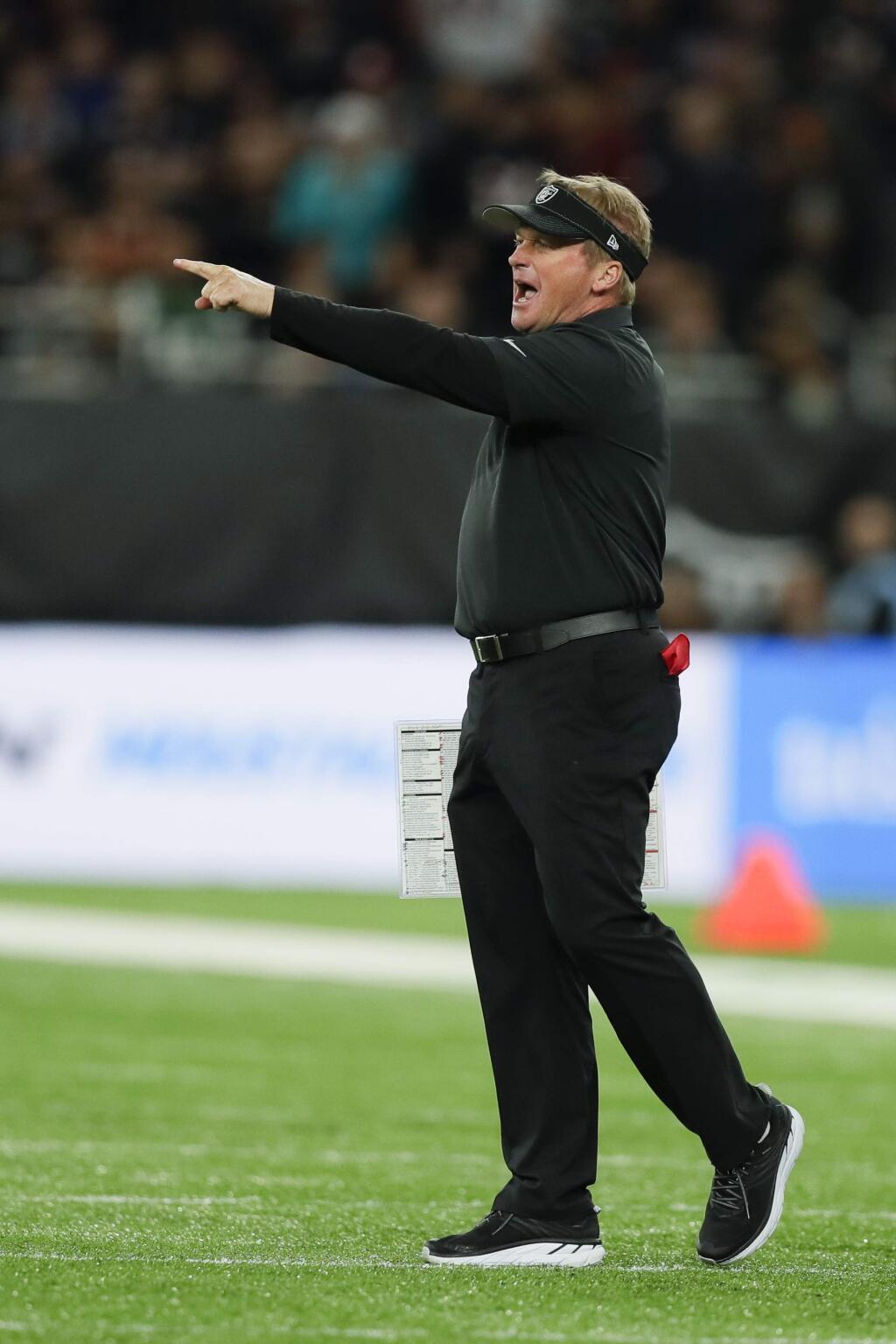 Oakland Raiders head coach Jon Gruden shouts during the first half of an NFL football game against the Chicago Bears at Tottenham Hotspur Stadium, Sunday, Oct. 6, 2019, in London. (AP Photo/Kirsty Wigglesworth)