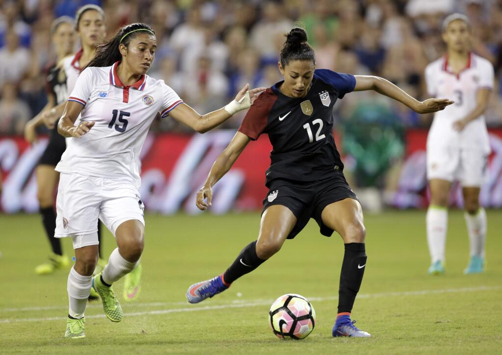 United States forward Christen Press (12) takes control of the ball as Costa Rica midfielder Cristin Granados (15) defends in the seconfd half of a women's international friendly soccer match, Friday, July. 22, 2016, in Kansas City, Kan. (AP Photo/Colin E. Braley)