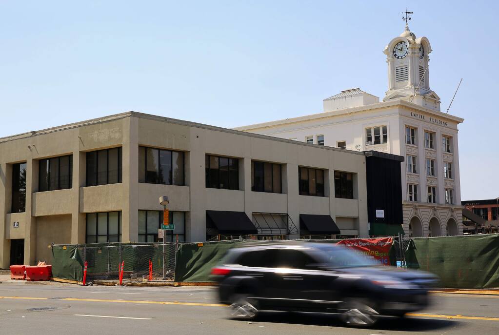 19 Old Courthouse Square, left, shown in a 2016 file photo, will be demolished this month to make way for a new building that will become part of the Hotel E development project. The new building will house hotel rooms, a Perry's restaurant and a Starbucks, and a rooftop cafe and bar. (Christopher Chung/ The Press Democrat)