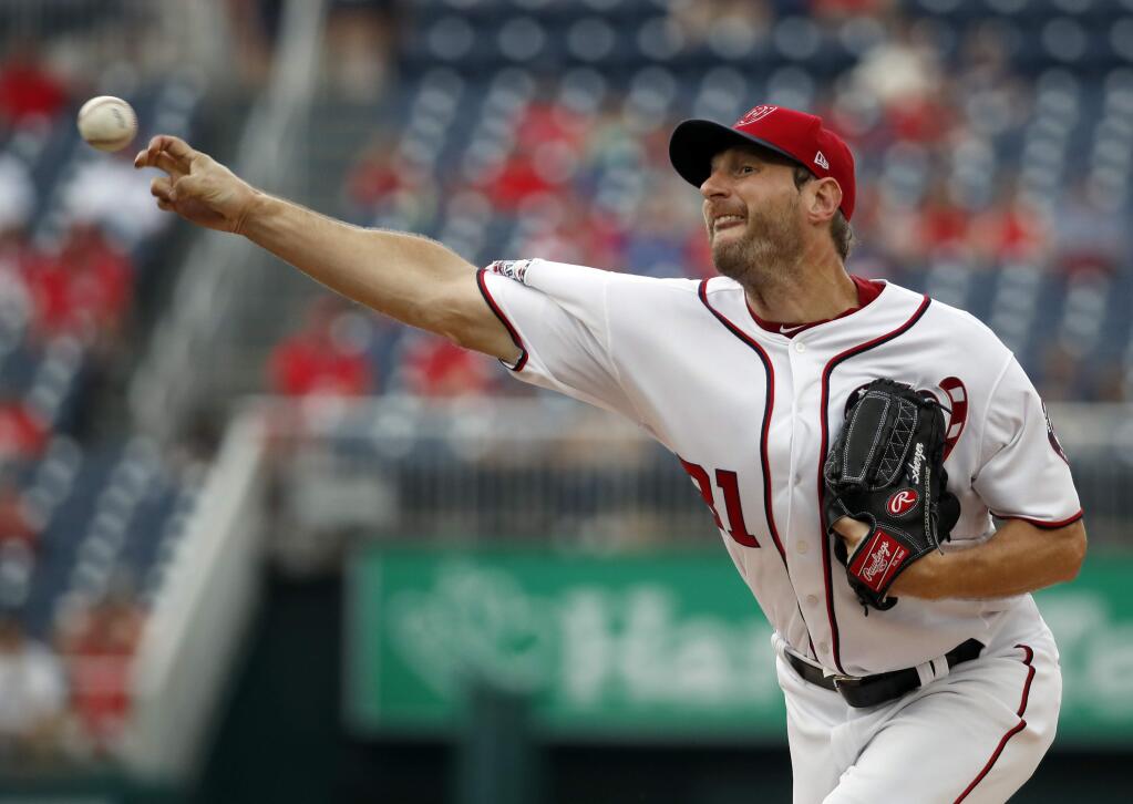 Washington Nationals starting pitcher Max Scherzer throws during the first inning of a baseball game against the San Francisco Giants at Nationals Park, Sunday, June 10, 2018, in Washington. (AP Photo/Alex Brandon)