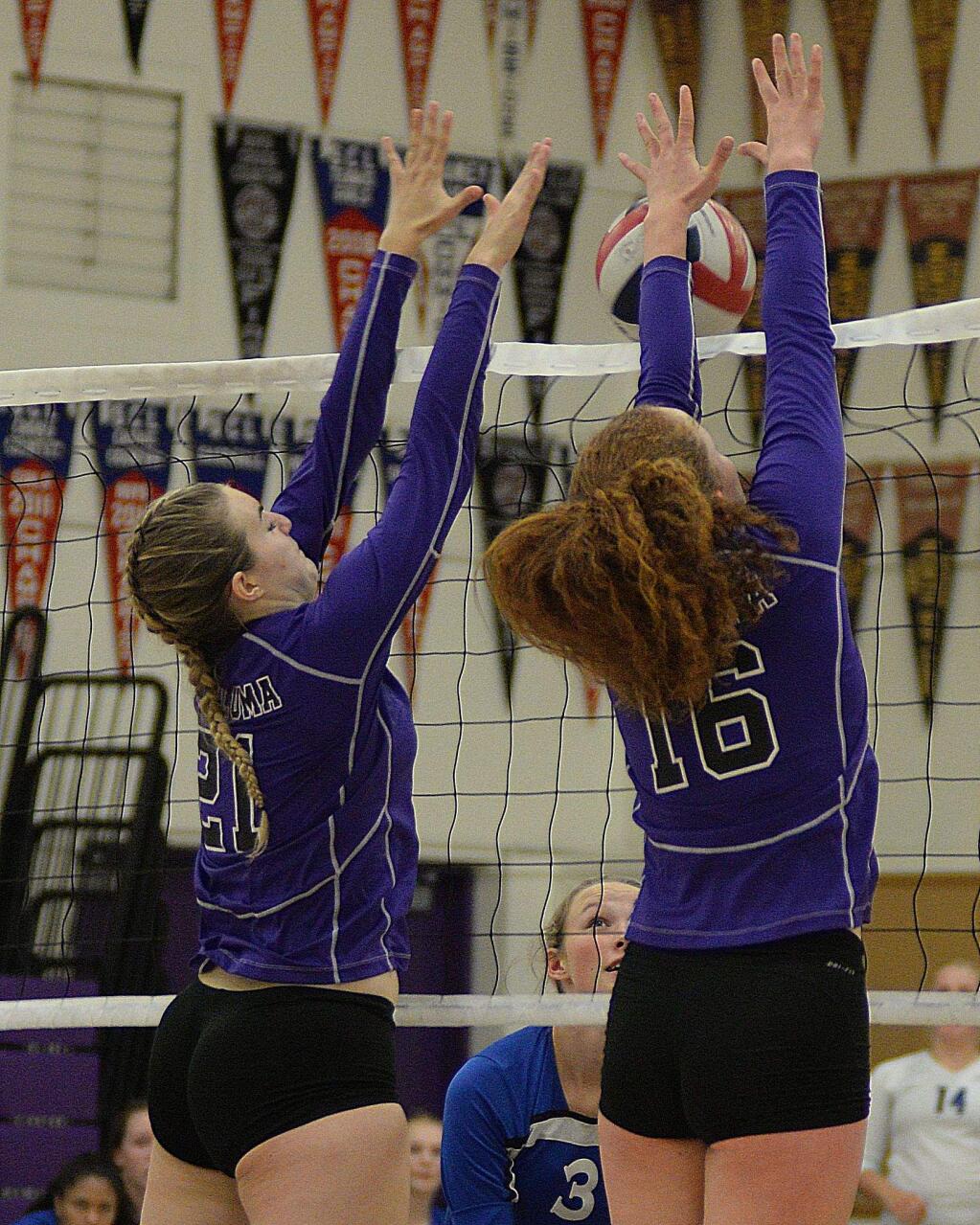 SUMNER FOWLER/FOR THE ARGUS-COURIERPetaluma's Edyn Gavisch and Hannah Dillingham set up a double block in the Trojans' 3-0 win over Analy in SCL Tournament.