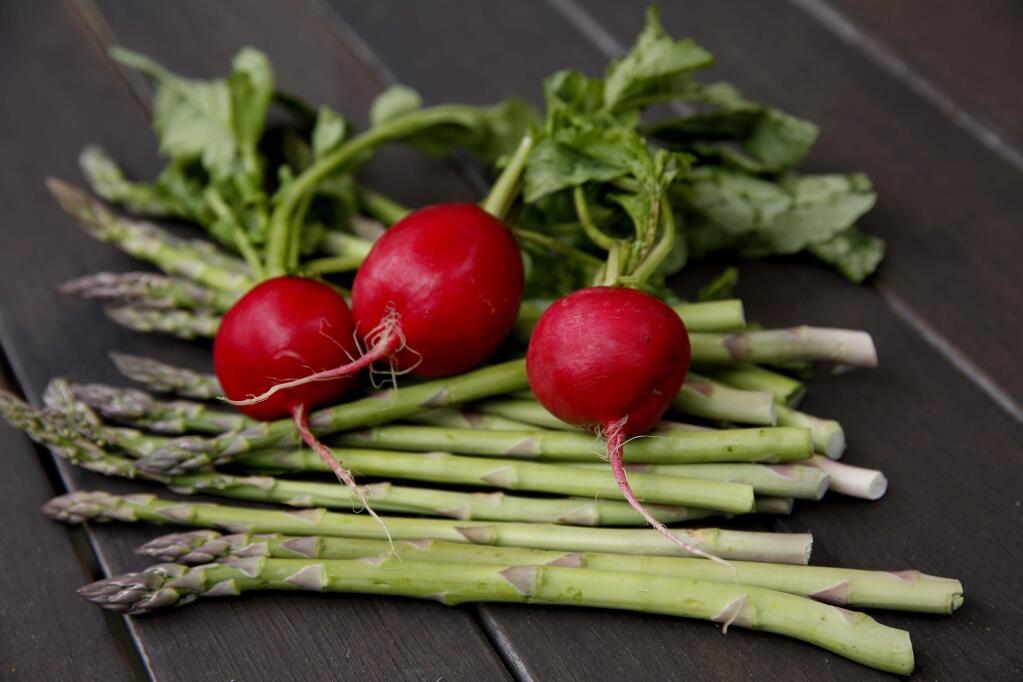 Radishes and asparagus at the home of cookbook author Lia Huber in Healdsburg, California on Thursday, May 14, 2020. (BETH SCHLANKER/ The Press Democrat)