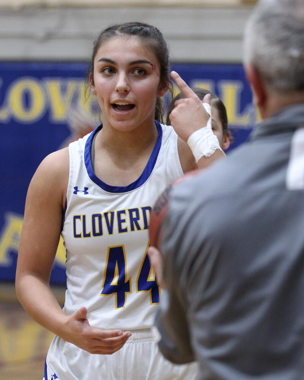 Cloverdale High School's Tehya Bird (44) points to a cut she received just after scoring her 2,000th point, against Middletown High School in Cloverdale on Friday, February 7, 2020. (Photo by Darryl Bush / For The Press Democrat)
