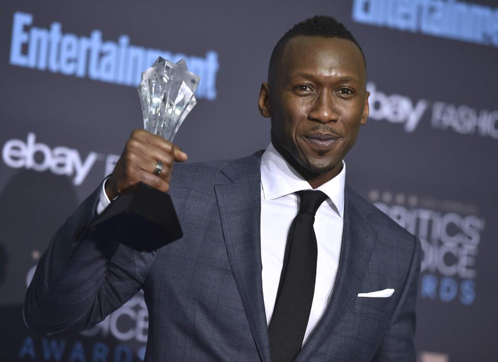 Mahershala Ali poses in the press room with the award for best supporting actor for 'Moonlight' at the 22nd annual Critics' Choice Awards at the Barker Hangar on Sunday, Dec. 11, 2016, in Santa Monica, Calif. (Photo by Jordan Strauss/Invision/AP)