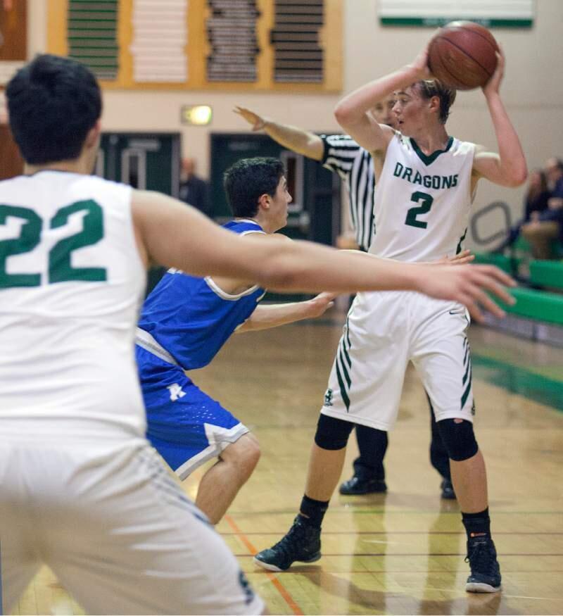 LUKE SEVERSON looks to pass or shoot in action against Analy. The Dragon varsity basketball team lost for the second time this season against the Sebastopol team last Friday, 62-34. (Robbi Pengelly/Index-Tribune)