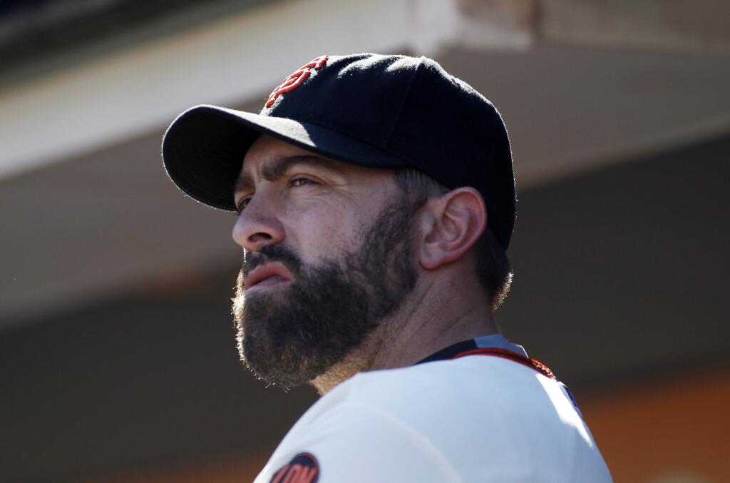 San Francisco Giants pitcher Jeremy Affeldt looks on from the dugout during the ninth inning of a baseball game against the Arizona Diamondbacks, Sunday, Sept. 20, 2015, in San Francisco. (AP Photo/George Nikitin)