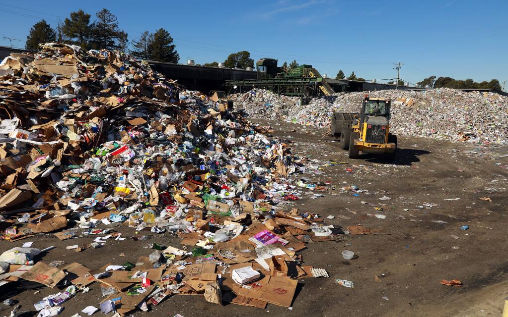 Piles of recyclable material fill the North Bay Corporation's recycling facility on Standish Avenue in Santa Rosa on Monday, Jan. 30, 2017. (John Burgess/The Press Democrat)