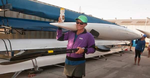 A smile, a bottle, boat and oars for the Marathon/Half Marathon at the North Bay Rowing Club, on the Petaluma River on Sunday, September 6, 2015. (JOHN O'HARA/ FOR THE ARGUS-COURIER)