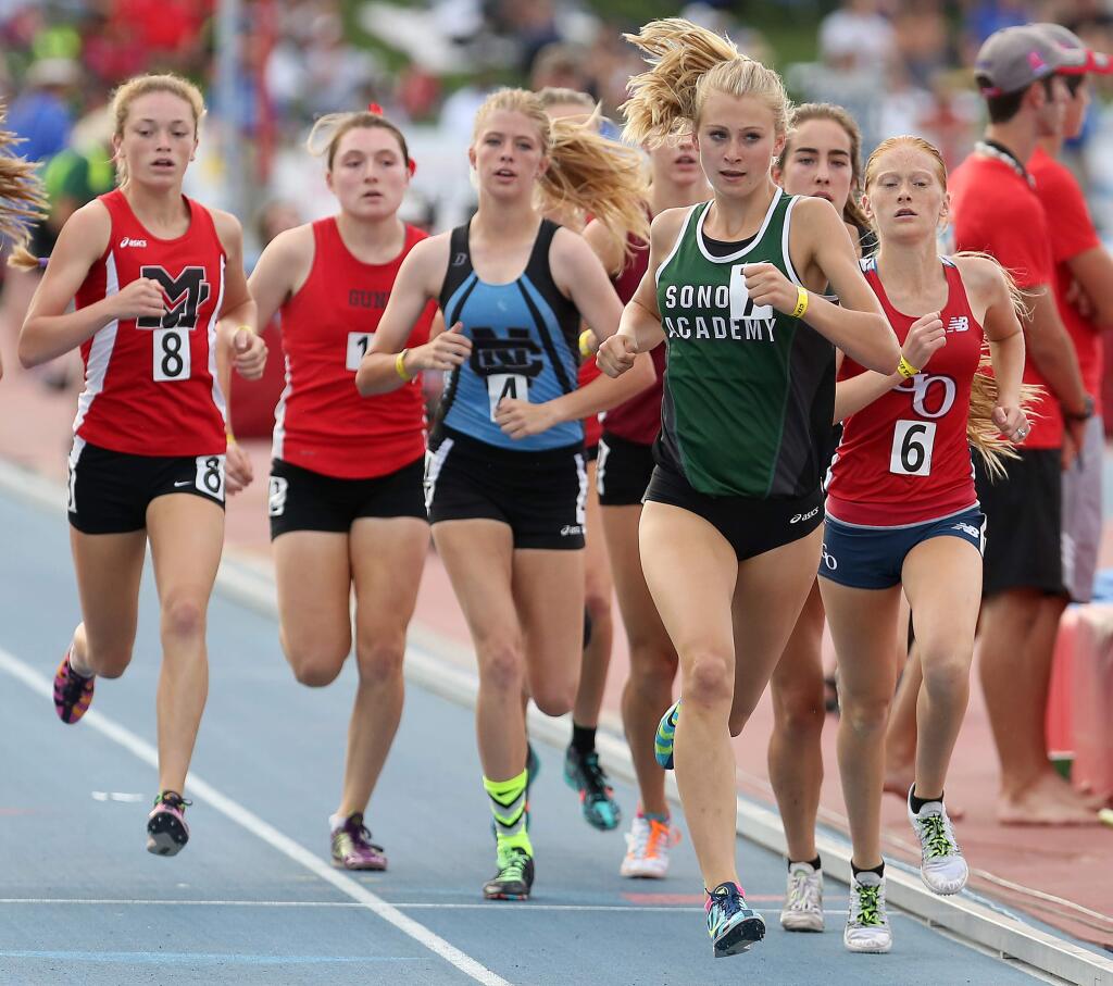 Sonoma Academy's Rylee Bowen, second from right, leads the second pack as she runs the first lap in the girls 1600 meter race during the 2015 CIF Track & Field Championships held at Veterans Memorial Stadium in Clovis, Saturday, June 6, 2015. (Crista Jeremiason/ The Press Democrat)