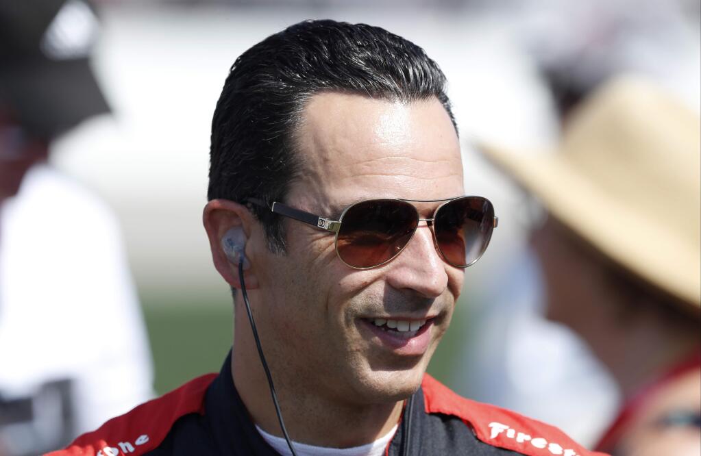 Helio Castroneves, of Brazil, looks on before the IndyCar race Sunday, July 9, 2017, at Iowa Speedway in Newton, Iowa. (AP Photo/Charlie Neibergall)